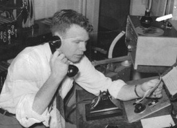 1954: Author hosting <i>Coca Cola Calling</i> in WHCU's Studio C.  Arrow at upper-right points to 8-Ball mic hung from ceiling.